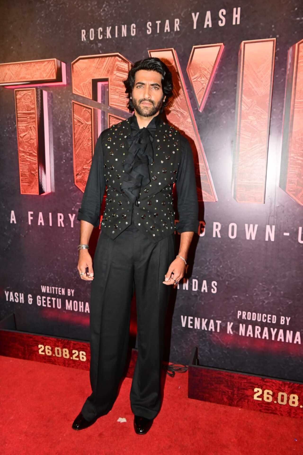Akshay Oberoi embraced an all-black look for the Toxic music launch. He teamed a studded waistcoat with a dramatic black shirt and trousers, adding a stylish, edgy touch to his red-carpet appearance.